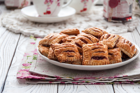 Homemade cookies from puff pastry with strawberry jamの写真素材
