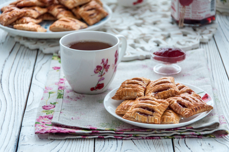 Homemade cookies from puff pastry with strawberry jamの写真素材