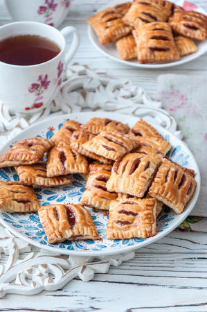 Homemade cookies from puff pastry with strawberry jamの写真素材