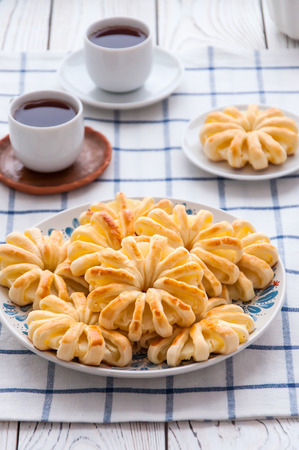 Pineapple ringlets in puff pastry, baked in the form of flowersの写真素材