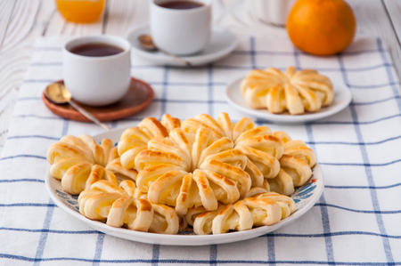 Pineapple ringlets in puff pastry, baked in the form of flowersの写真素材