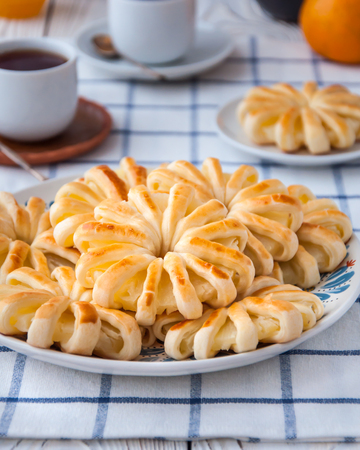 Pineapple ringlets in puff pastry, baked in the form of flowersの写真素材