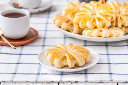 Pineapple ringlets in puff pastry, baked in the form of flowersの写真素材