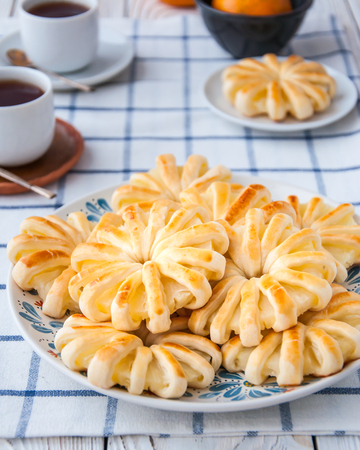 Pineapple ringlets in puff pastry, baked in the form of flowersの写真素材