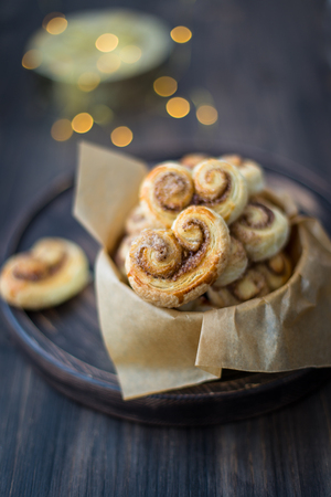 Cookies, curlicues, pretzels of puff pastry with sugar and cinnamonの写真素材