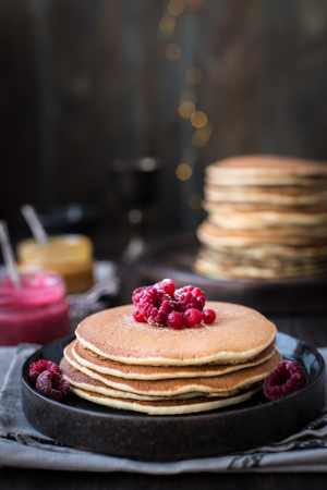 Pancakes with honey, jam and berriesの写真素材