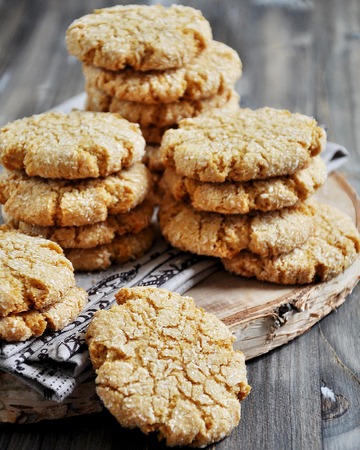 Stacks of homemade honey biscuits with cracks added with coconutの写真素材