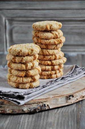 Stacks of homemade honey biscuits with cracks added with coconutの写真素材