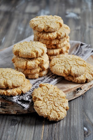 Stacks of homemade honey biscuits with cracks added with coconutの写真素材