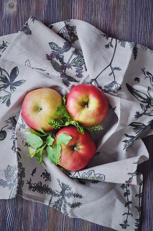 Fresh red apples on cotton towelsの写真素材