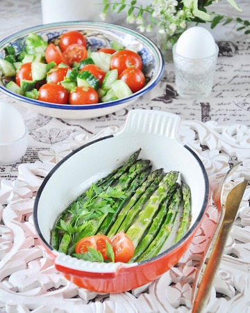 Breakfast of baked asparagus with boiled egg and cream cheeseの写真素材