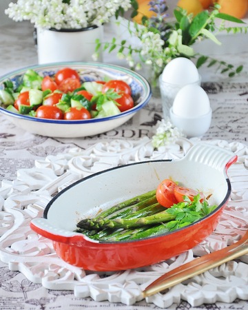 Breakfast of baked asparagus with boiled egg and cream cheeseの写真素材