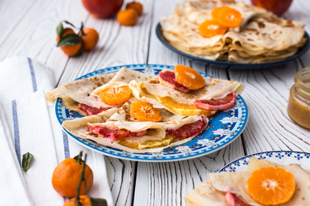 Maslenitsa. Crepe Suzet. Thin pancakes with honey and citrusの写真素材