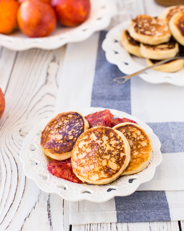 Curd cheese cakes with honey and red orangesの写真素材