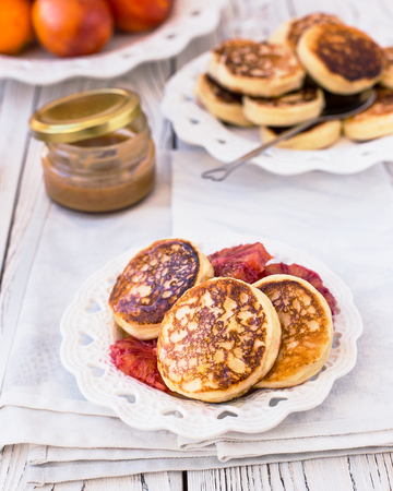 Curd cheese cakes with honey and red orangesの写真素材