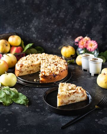 Homemade apple pie with shortcrust pastry on top, with shtrezel, shtreisel. Piece cut offの写真素材