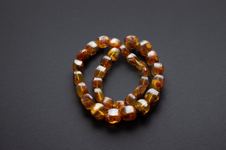 Natural Baltic amber necklace on dark background. High quality photoの写真素材