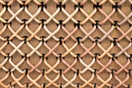 Close-up of rusty wire mesh fence weaving pattern. High quality photoの写真素材