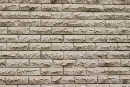 Light decorative stone brick wall. Modern architectural backgroundの写真素材