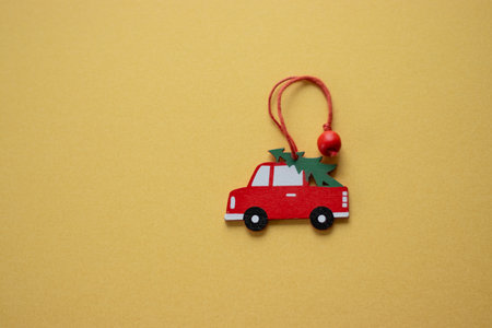 Christmas wooden ornament red car with a Christmas tree. High quality photoの写真素材