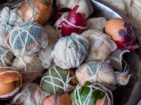 Home made traditional Easter egg coloring by using different leaves, plants and flowers. Eggs...