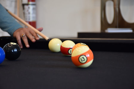 Black billiard table, Playing billiard - Close-up shot of a man playing billiard