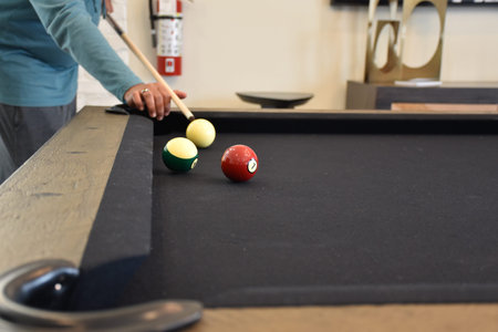 Black billiard table, Playing billiard - Close-up shot of a man playing billiard