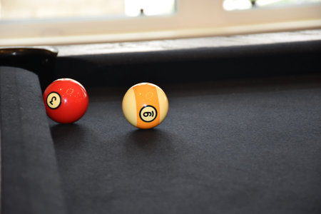 Black billiard table, Billiard balls in a pool table, focused on 9 ballの写真素材