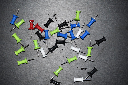 colorful punch pins drawing pins on black background, office supply, notes, school supply, notice...
