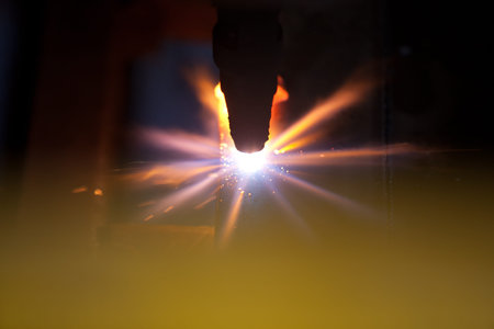 Details of a welding machine with sparks. 