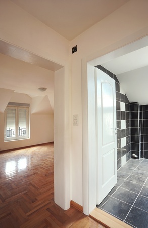 Interior of a new home, empty room with white walls and parquet. の写真素材