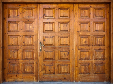 Old wide wooden doors, entrance of a church. の写真素材
