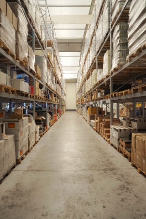 Warehouse interior, classified beverages packs on the shelves. の写真素材
