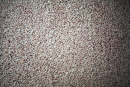 Pattern of a wall texture with small brown marble stones. の写真素材