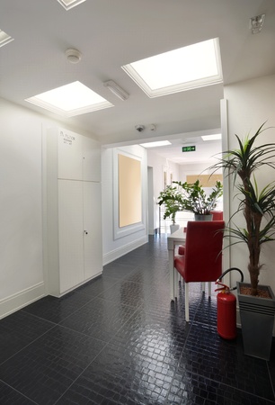 Interior of a hotel, halls in white with lighting equipment. の写真素材