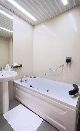Interior of a hotel bathroom in white.の写真素材