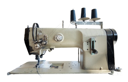 Old sewing machine on white background. の写真素材