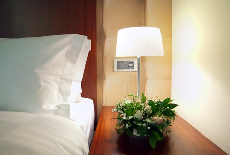 Detail of a room corner, lamp beside bed. の写真素材