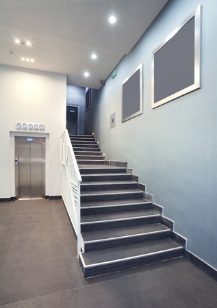 Interior of a building hall, hotel stairs, modern design in grey colors. の写真素材