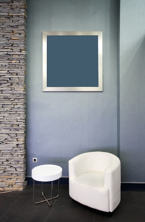 Details of an interior of a hotel building, armchair and empty frame, modern design. の写真素材