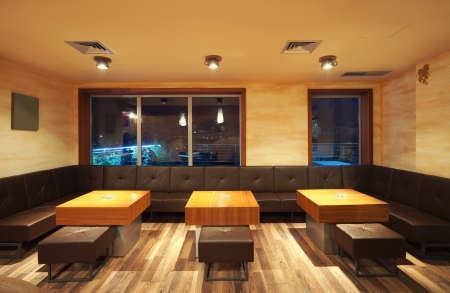 Interior of a modern restaurant, classical design, by night. の写真素材