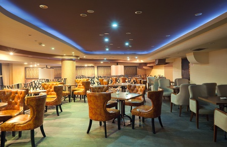 Interior of a modern restaurant, classical design, by night. の写真素材