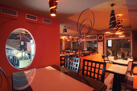 Interior of a restaurant, modern design in few colors, orange and brown  の写真素材