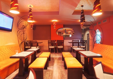Interior of a restaurant, modern design in few colors, orange and brown  の写真素材