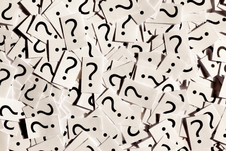 Just a lot of question marks on white papers  の写真素材
