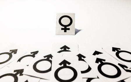 Bunch of male symbols going toward one female symbol  