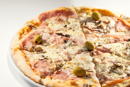 Pizza called Margarita, classical style, just hum, cheese and olives as ingredients, studio isolated  の写真素材