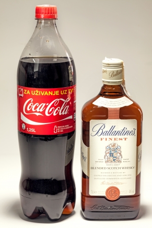 Cacak, Serbia - May 20, 2013: Coca Cola and Ballantine's Whiskey, studio isolated. のeditorial素材