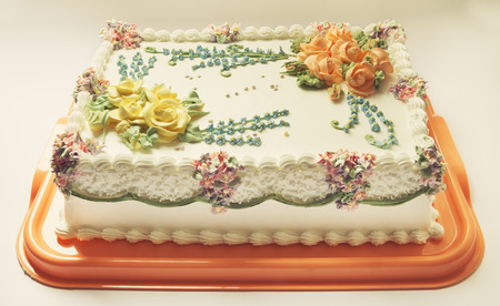 Classical birthday cake design with a lot of flowers of cream  の写真素材