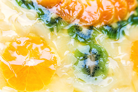 Details of fruity cake, colorful mosaic design of orange and kiwi  の写真素材